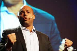 Thomas Anglero Holding The Attention Of A Large Audience During A Keynote